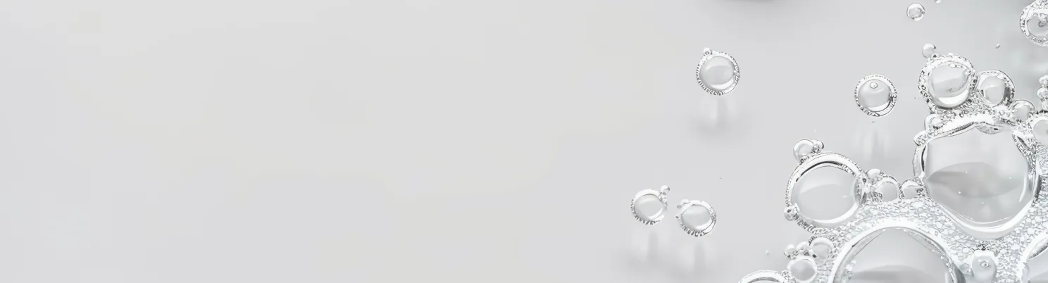 Clear glossy bubble droplets symbolizing Selfnamed's clean beauty formulas